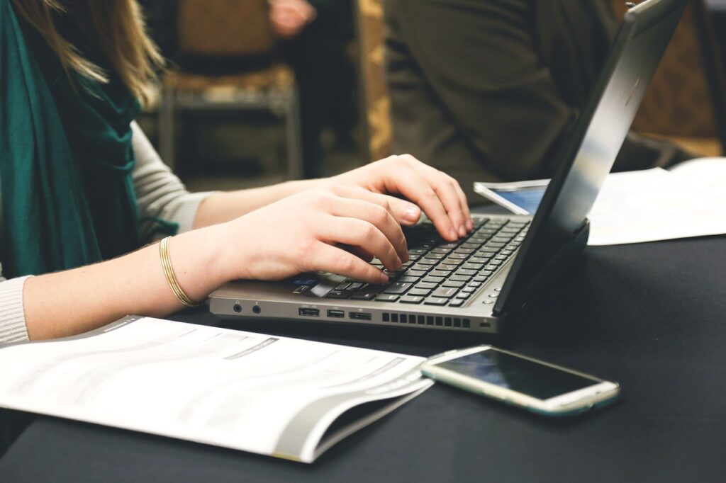 Woman typing on a laptop