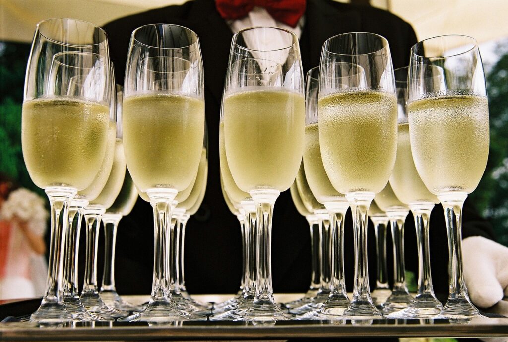 Champagne glasses ready to celebrate 100 Retained HR Services clients | HR Solutions