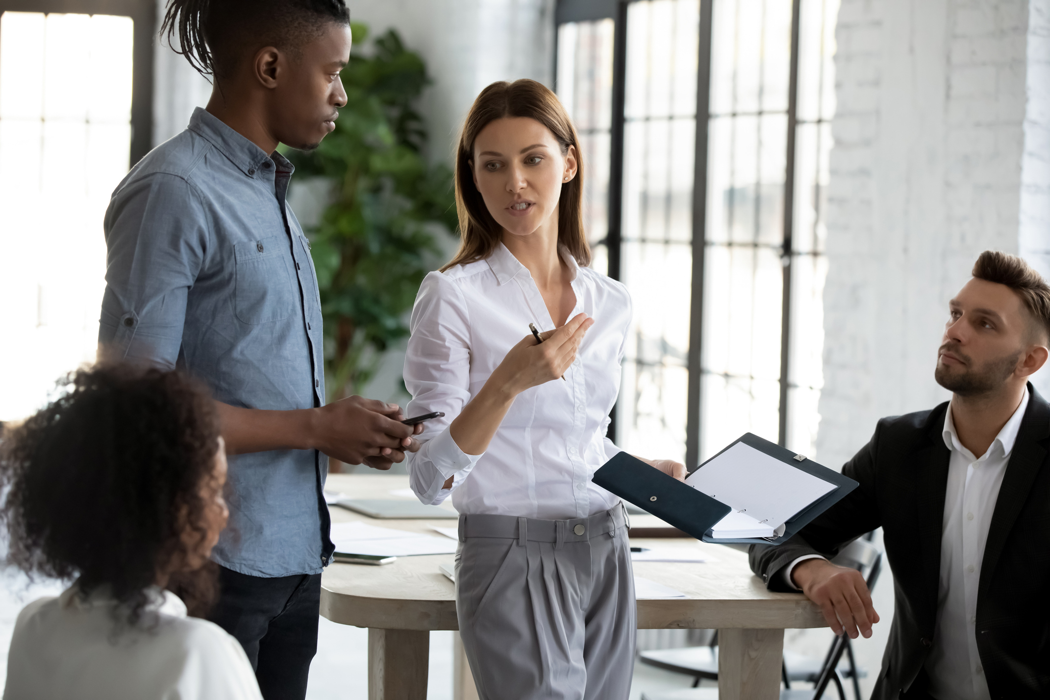 Business men and women talking